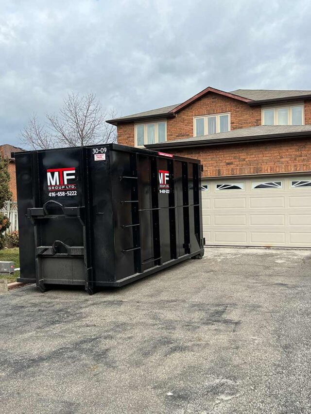 30 yard garbage bin rental in a driveway