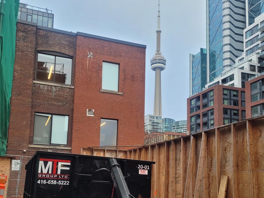 garbage bin rental with the CN tower behind it